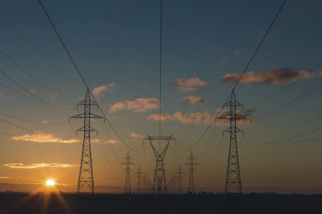 Transmission towers at sunset